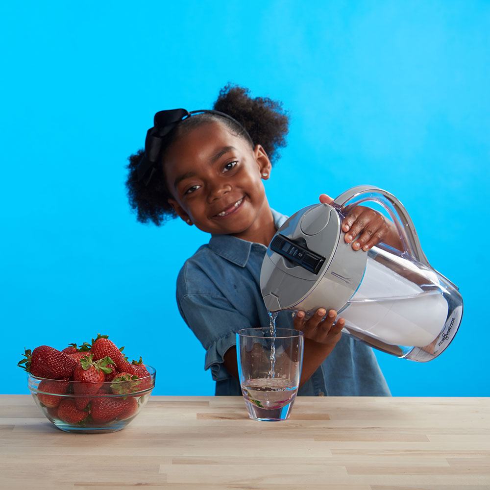 Why should Your Family Invest in a ZeroWater Jug? -Young child using a ZeroWater Jug!