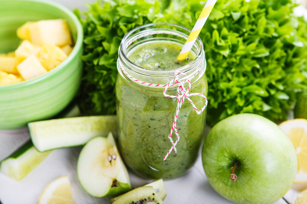 Water based recipes - Fresh organic green smoothie with salad, apple, cucumber, pineapple and lemon as healthy drink anyone?