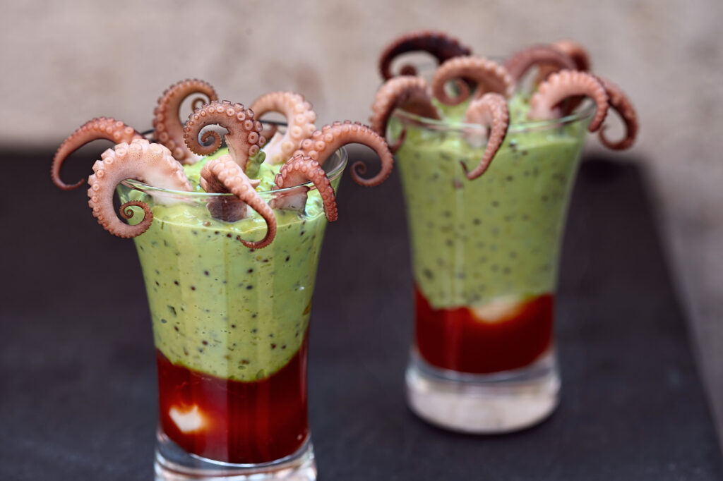 Halloween appetizer food. Monster octopus green dips.